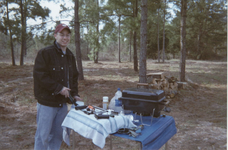 Person standing behind a folding camp table