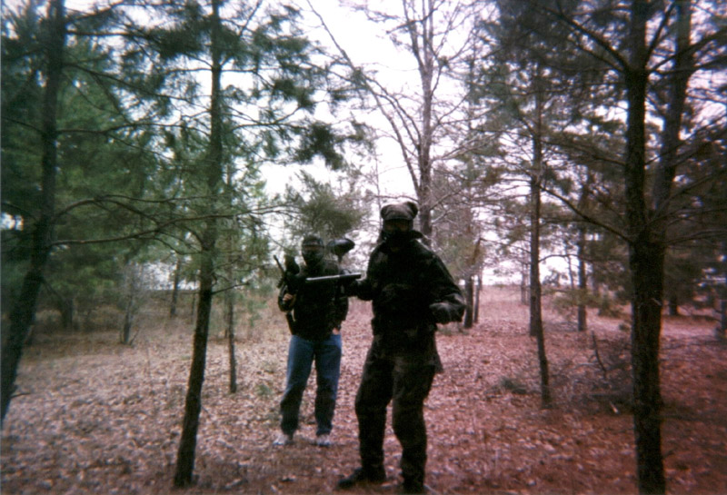 Two players standing together in the woods