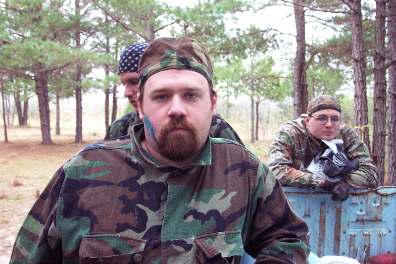 Two camouflaged players near field cover