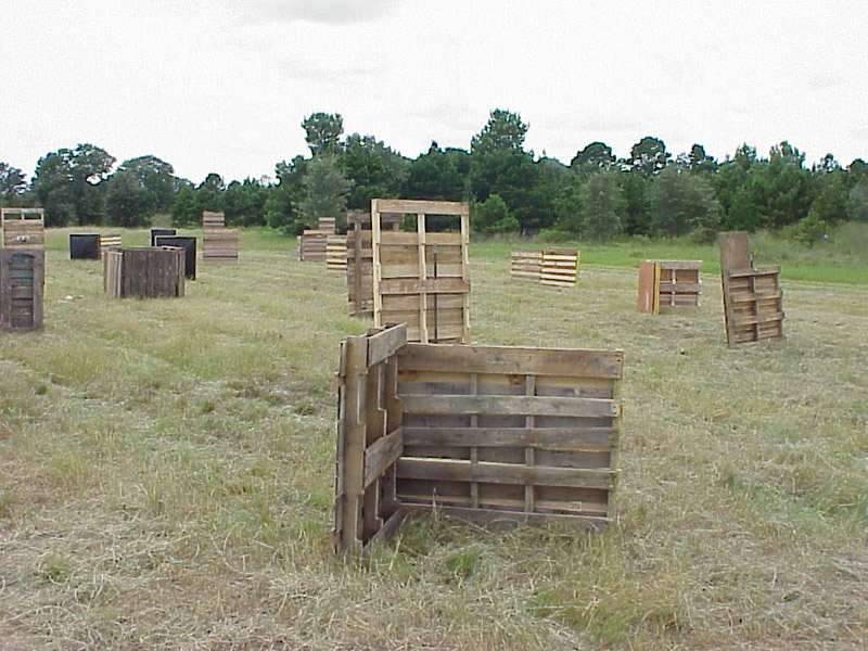 Close wooden barricade with more cover across the field
